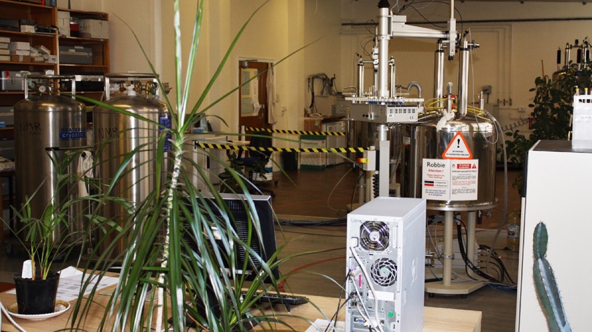 NMR laboratory with spectrometers and computer workstations used for spectral analysis