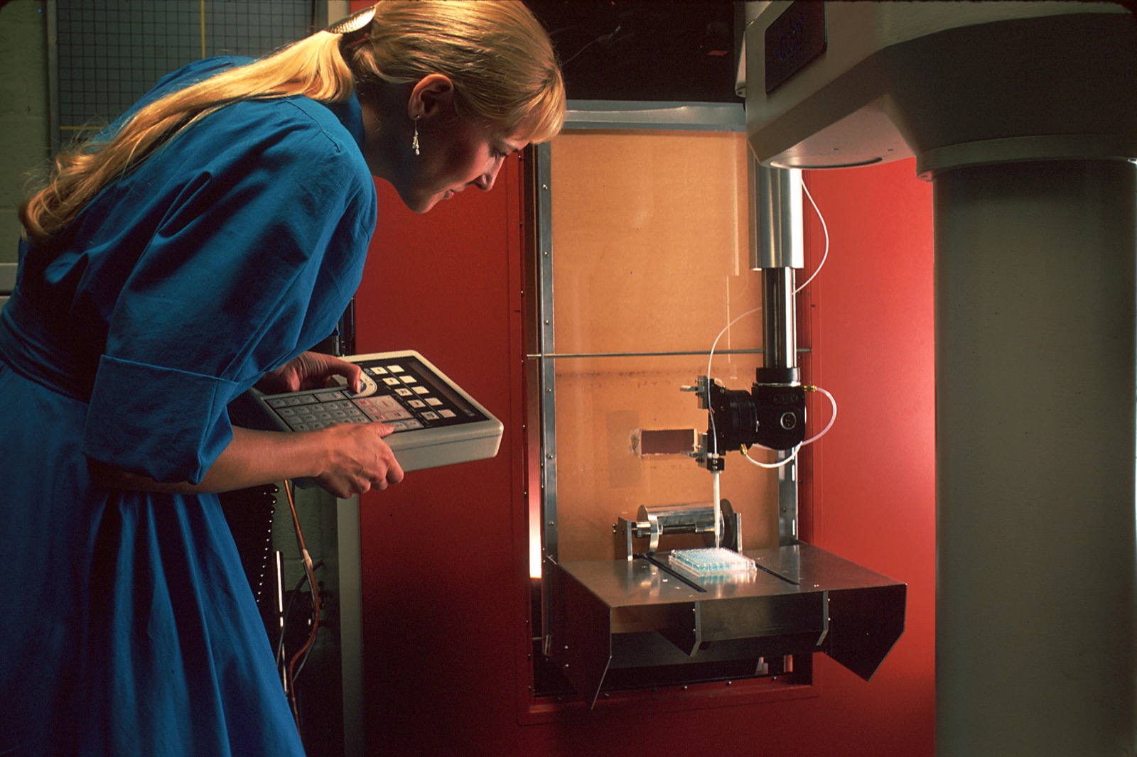 A laboratory robot preparing chemical samples for analysis